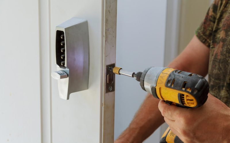 man-installing-of-the-door-with-lock-key-security-2021-08-30-22-58-04-utc.jpg
